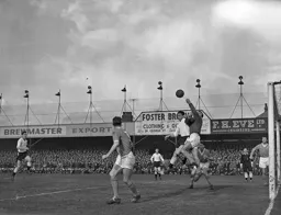 Bob Morton cannot quite reach this high ball