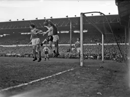 Bob Morton is beaten to the ball