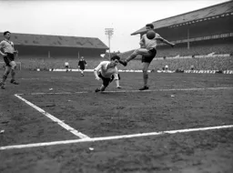 Allan Brown gets in a diving header