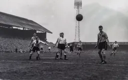 Bob Morton and Allan Brown watch as the ball goes out of play