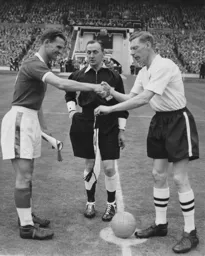 Syd Owen and his Forest counterpart Jack Burkitt exchange pennants