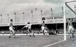 A high ball comes into a well defended box