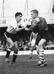 Gordon Turner up against Bolton keeper Eddie Hopkinson