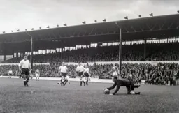 Ron Baynham falls on the ball