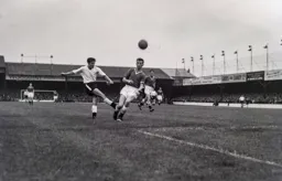 Gordon Turner somehow connects with the ball