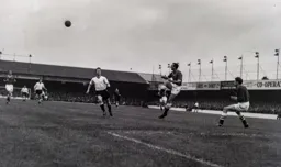 Billy Bingham watches as the ball is cleared