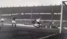 Gordon Turner challenges the goalkeeper