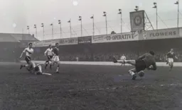Everton goalkeeper Albert Dunlop gets down to a low ball