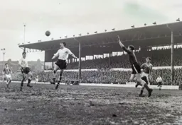 Gordon Turner goes up for a header