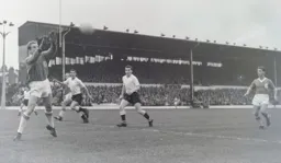 Liverpool's Bert Slater safely gathers