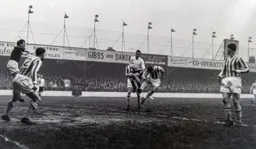 Allan Brown has two defenders on him