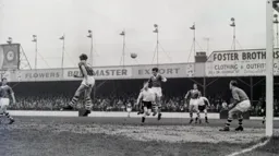 The ball is headed away by the Rotherham defence