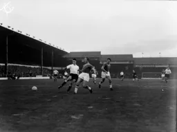 Alec Ashworth in a race for the ball