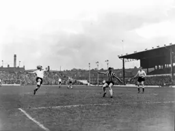 Gordon Turner tries to control the ball watched by Mark Lownds
