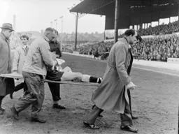 Gordon Turner is taken off with a cut nose