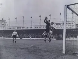 Ron Baynham safely gathers the ball