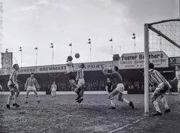 Gordon Turner gets his head to the ball