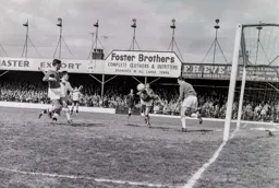 A Charlton defender heads clear