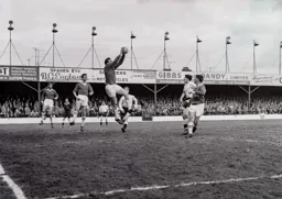 Charlton goalkeeper Frank Reed holds on to the ball