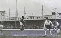 John Reid nods the ball down