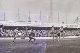 Tommy McKechnie gets his head to the ball