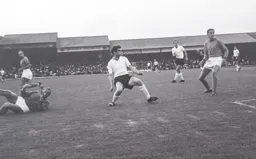 David Pleat in the centre of the action