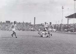 Mark Lownds hurdles over Terry Oldfield