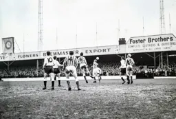 Bruce Rioch and Tommy McKechnie watch as Sunderland clear this attack