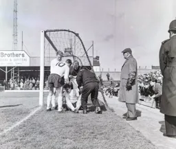 Graham Caleb is injured. Mark Lownds and John Reid show their concern
