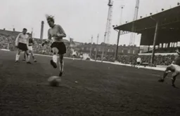 John Reid just fails to block the ball