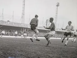 Colin Tinsley catches the ball with Robert Thomson in close support