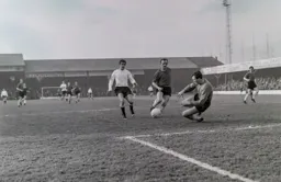 John O`Rourke chases a through ball but John Heath will get there first