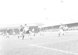 Graham French plays a high ball towards the goal