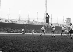 John Reid can only watch as United keeper Sandy Kennon makev a safe catch