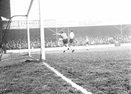 George Ramage grabs the ball as Matt Woods provides cover
