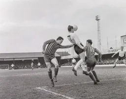 It looks like Graham French has a faceful of ball as he looks to find Tony Read