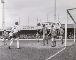 Tommy McKechnie and the City defence watch as the ball has gone wide