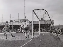 Tommy McKechnie watches as a flying header goes wide of the target