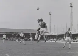 David Pleat competes for a high ball with Mick Clarke