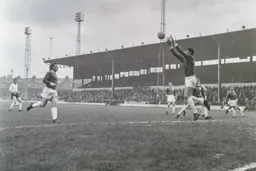 Bradford keeper John Hardie makes an easy catch as David Pleat watches from a distance