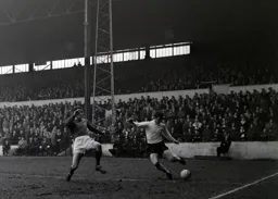 Bruce Rioch is about cross the ball