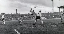 Tony Read gets above Ambrose Clarke to head the ball across the penalty area