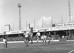 City keeper John Smout makes a safe catch under pressure from Gordon Riddick
