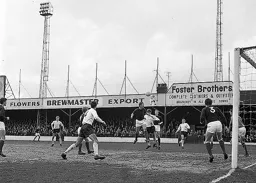 Ray Harford heads the ball clear for City in front of Gerry King