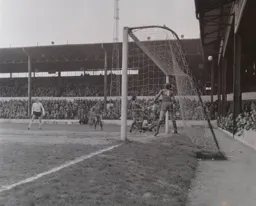 Keith Allen watches the ball sail into the crowd at the Oak Road end