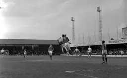 Keith Allen challenges for the ball