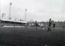 Jim Tugman heads the ball away from Bruce Rioch and Keith Allen