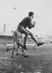 The Wrexham goalkeeper gathers the ball