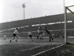 Roy Sproson heads the ball clear with Ray Whittaker and Ian Buxton in close attendance
