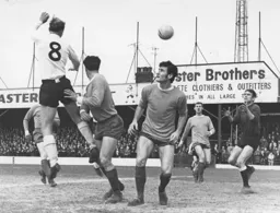 Ian Buxton heads across goal